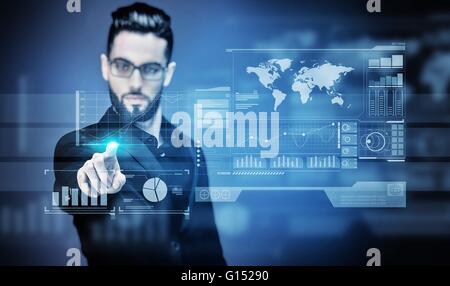 Portrait of a young Businessman touching a virtual screen Stock Photo