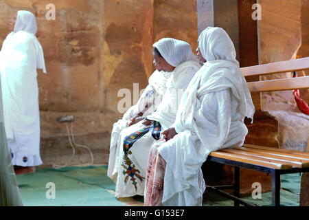 WUKRO, ETHIOPIA-MARCH 29: Orthodox christian devotees attend religious services dressed in habesha kemis and netela white clothe Stock Photo