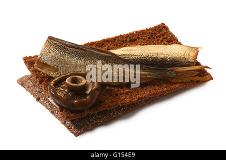 Bread crisp (crispbread open-faced sandwich) with smoked sprats and forage mushrooml. Clipping paths for both crisp and shadow,  Stock Photo