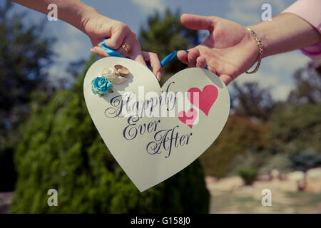 a paper heart with the words happily ever after Stock Photo