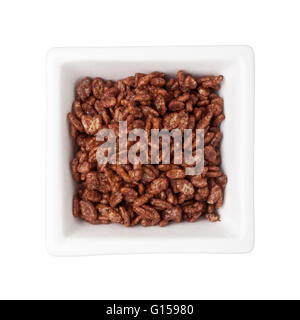 Chocolate flavored breakfast cereal in a square bowl isolated on white background Stock Photo