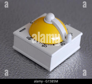 Vintage kitchen timer, yellow and white plastic Stock Photo