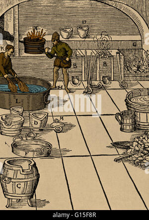 Color enhanced woodcut showing workers purifying silver. For coins--the use to which most silver was put--the metal obtained by the cupellation of lead was not the best, because it contained too much undesirable material. It was necessary to purify it sti Stock Photo