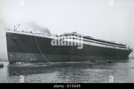 The famous Titanic steamship after t's initial launch, heading the the Thompson Wharf for fitting out. The Titanic steamship was the largest ship ever built at the time. In 1912, the ship sailed from Southampton, England to New York City. On April 14th, 1 Stock Photo