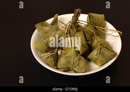 Traditional Chinese food chimaki wrapped in bamboo leaf Stock Photo