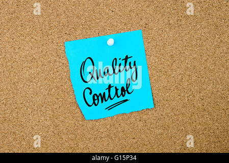 Quality Control written on blue paper note pinned on cork board with white thumbtacks, copy space available Stock Photo