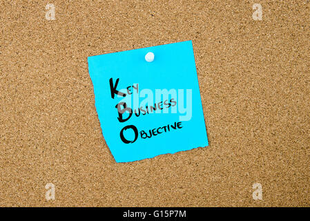Business Acronym KBO Key Business Objective written on blue paper note pinned on cork board with white thumbtack, copy space available Stock Photo