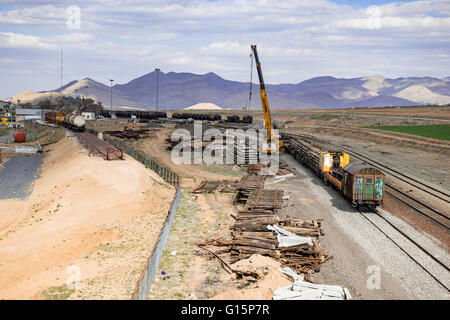 Replacing wooden cross ties with concrete ones in Arak, Markazi Province, Iran. Stock Photo