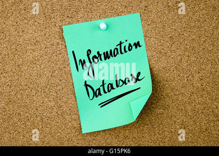 Information Database written on green paper note pinned on cork board with white thumbtacks, copy space available Stock Photo