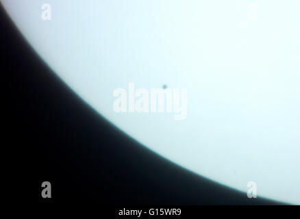 A picture taken with a camera mounted to a 750mm telescope shows the planet Mercury (L) as it passes in front of the sun, as seen from Hamburg, Germany, 09 May 2016. Photo: DANIEL BOCKWOLDT/dpa Stock Photo