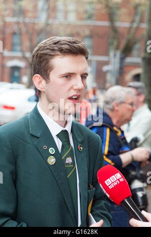 Belfast, UK. 9th May, 2016. Cónall Ó Corra from Coláiste Feirste school  being interviewed by the BBC, who was the main speaker at the protest outside BBC headquarters Omeau Avenue Belfast, The protest is in connection with what was described as the BBC cutting them short, when a question was raised in regard to the Irish language during a the BBC election debate Credit:  Bonzo/Alamy Live News Stock Photo