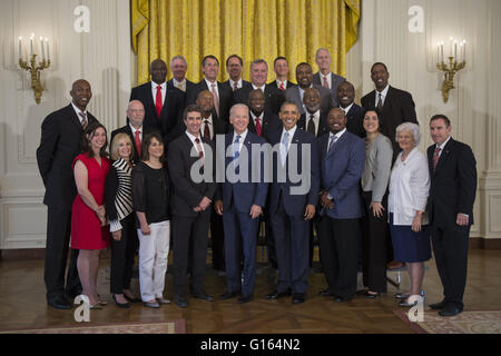 May 9, 2016 - Washington, District of Columbia, United States of America - US President Barack Obama, with Vice President Joseph Biden, greets former players and staff of the 1983 NCAA National Basketball Championship North Carolina State Wolfpack in the East Room of the White House in Washington, DC, USA, 09 May 2016. The President and Vice President met briefly with members of the team and their families in the East Room. The team was previously unable to visit the White House to be recognized for their championship.Credit: Shawn Thew/Pool via CNP (Credit Image: © Shawn Thew/CNP via ZUMA Stock Photo