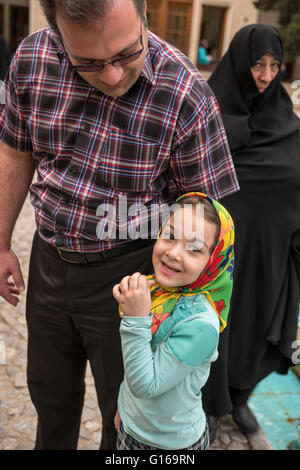 Father and daughter in Fin Garden practice her English with visitors. Stock Photo