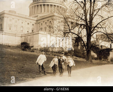 Entitled: ' In comparison with governmental affairs newsies are small matters. This photo taken in the shadow of the National Capitol where the laws are made. This group of young newsboys sells on the Capitol grounds every day, ages 8 yrs., 9 yrs., 10 yrs Stock Photo