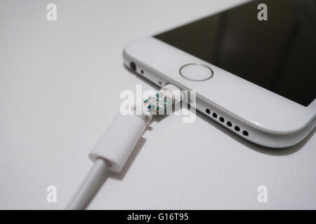broken iphone charging cable Stock Photo