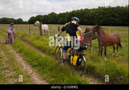 Family out cycling in the British countryside in Kent UK Stock Photo