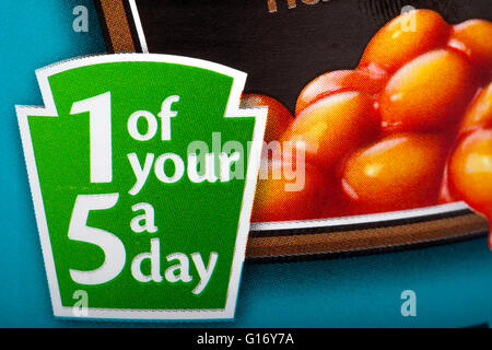 A sign on a tin of food informing the consumer that the contents contain 1 of your 5 recommended fruit and vegetables a day. Stock Photo