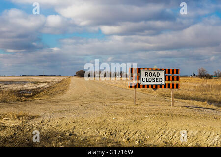 Road closed sign on an old dirt road in rural Saskatchewan Canada. Stock Photo
