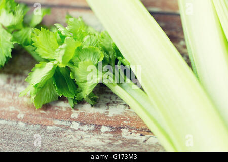 close up of celery stems on wooden table Stock Photo