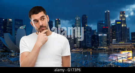man thinking over gray background Stock Photo
