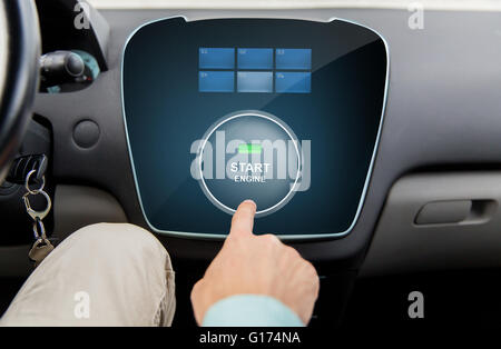 close up of man using starter application in car Stock Photo