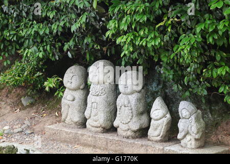 Smiling Buddha Stone statues Stock Photo