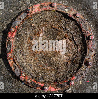 Corroded cast iron bolted circle. Stock Photo