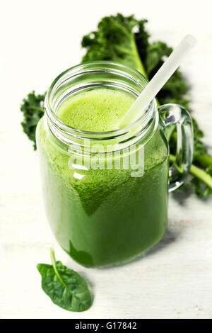 Kale smoothie in glass on wooden background.Copyspace Stock Photo - Alamy