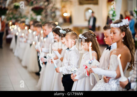 LVIV, UKRAINE - MAY 8, 2016: The ceremony of a First Communion in the Church of St. Peter the Great of Ukrainian Greek Catholic  Stock Photo