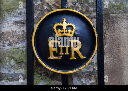 Queen Elizabeth II symbol on a gate at the Tower of London. Stock Photo