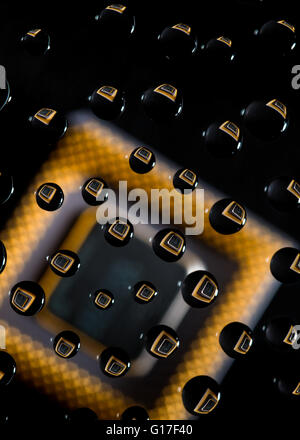 Waterdrops reflecting computer chip Stock Photo
