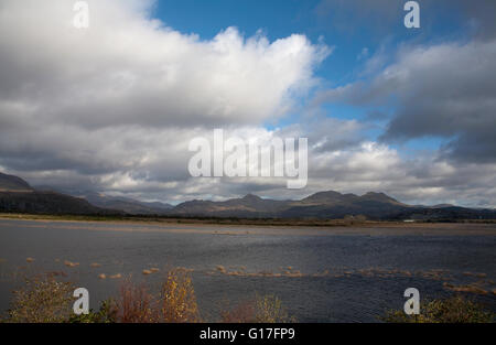 Moelwyn Mountains and Cnicht looking across the flooded estuary of The Afon Glaslyn from the Cob at Porthmadog Snowdonia Wales Stock Photo
