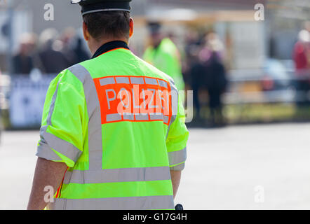 german policeman stands on a street Stock Photo