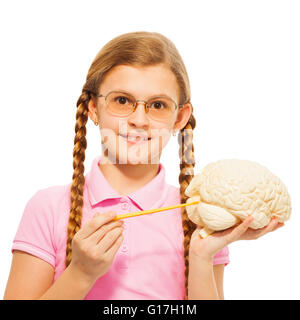 Schoolgirl in glasses holding cerebrum model Stock Photo