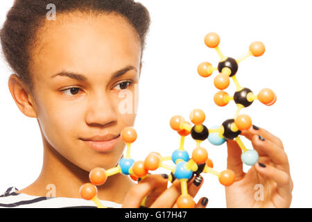 Close-up photo of African girl and molecular model Stock Photo