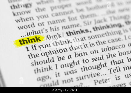 Detail of the english word 'think' highlighted and its definition from the dictionary Stock Photo