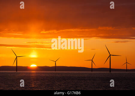 Sunrise over Walney Offshore Wind Farm off the Cumbrian Coast in the UK Stock Photo