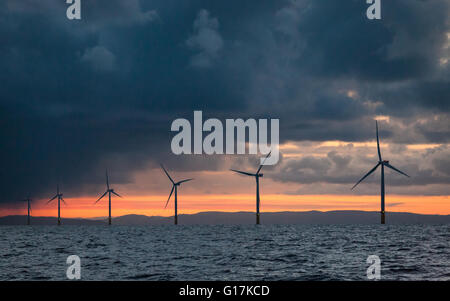 Sunrise over Walney Offshore Wind Farm off the Cumbrian Coast in the UK Stock Photo