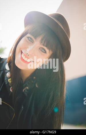 Happy young woman with nose rings Stock Photo