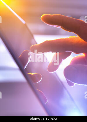 Man using touchscreen device, close-up Stock Photo