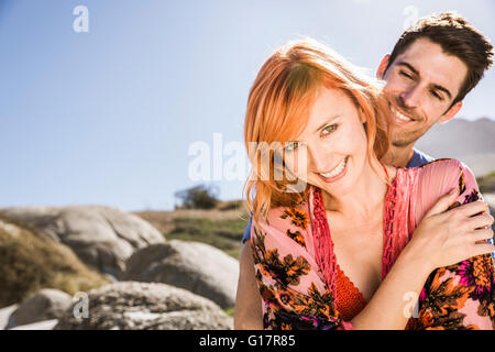 Portrait of couple outdoors, smiling