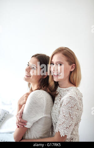 Side view portrait of two beautiful young women Stock Photo