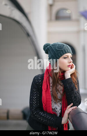 Beautiful young woman standing on the bridge Stock Photo