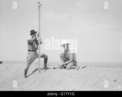 Land Surveyors from Pine Ridge land Use Project on Stock Water Dam, Dawes County, Nebraska, USA, Arthur Rothstein, U.S. Farm Security Administration, May 1936 Stock Photo