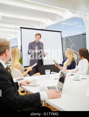 Consultant in a presentation during a business meeting in the conference room
