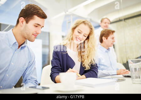 Business people planning together a business strategy in a business meeting Stock Photo