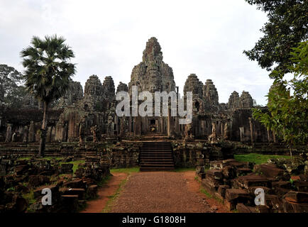 The Bayon is a well-known and richly decorated Khmer temple at Angkor in Cambodia. Stock Photo