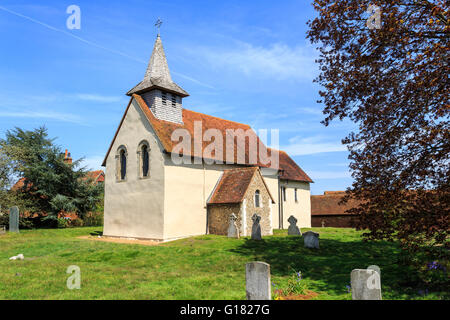 Wisley Church exterior, a small historic building in Wisley village, Surrey, UK dating back to Norman times in about 1150 on a sunny day with blue sky Stock Photo