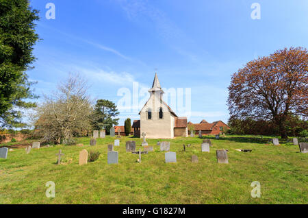 Wisley Church exterior, a small historic building in Wisley village, Surrey, UK dating back to Norman times in about 1150 on a sunny day with blue sky Stock Photo