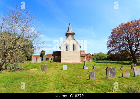 Wisley Church exterior, a small historic building in Wisley village, Surrey, UK dating back to Norman times in about 1150 on a sunny day with blue sky Stock Photo